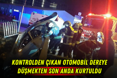 Kontrolden çıkan otomobil dereye düşmekten son anda kurtuldu