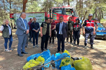 Burhaniye’de orman yangınlarına karşı ormanda çöp toplama etkinliği yapıldı
